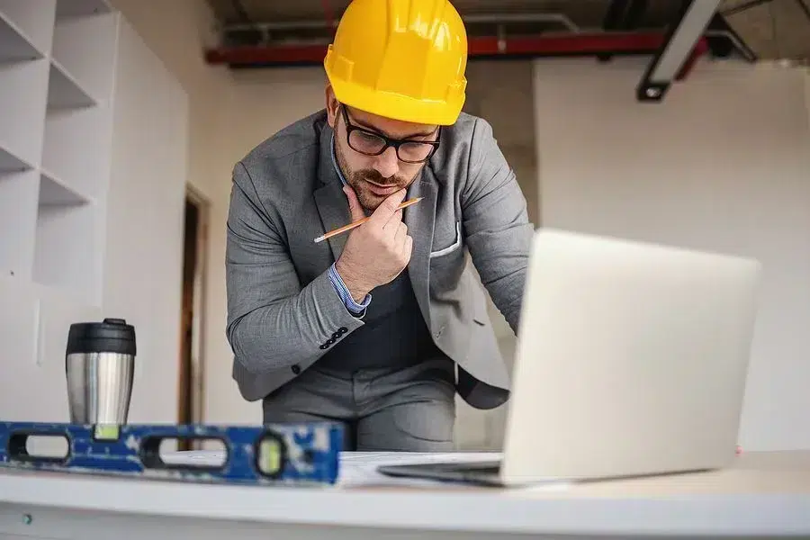 General contractor looking at computer.
